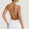 Robe courte Eartha à découpes et dos nu, en blanc Robe courte Eartha à découpes et dos nu, en blanc