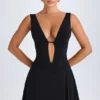 Robe courte Kalista à décolleté plongeant et découpes, en noir Robe courte Kalista à décolleté plongeant et découpes, en noir