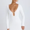 Robe courte à manches longues et découpes Mavisa en blanc