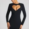 Robe courte à manches longues Luciana avec découpe en forme de cœur, en noir Robe courte à manches longues Luciana avec découpe en forme de cœur, en noir