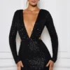 Robe courte Marva à découpes et ornements, en noir Robe courte Marva à découpes et ornements, en noir
