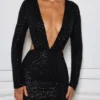Robe courte Marva à découpes et ornements, en noir Robe courte Marva à découpes et ornements, en noir