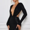 Robe courte Marva à découpes et ornements, en noir Robe courte Marva à découpes et ornements, en noir