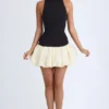 Robe courte Nabila à col roulé en modal, taille basse et ourlet bouffant, en noir