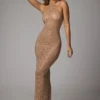 Robe de soirée Soraya à col haut, en maille transparente embellie, couleur amande Robe de soirée Soraya à col haut, en maille transparente embellie, couleur amande