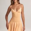 Robe Kelbie en modal froncé, coupe trapèze, couleur pêche Robe Kelbie en modal froncé, coupe trapèze, couleur pêche