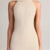 Robe longue à col dos nu et détails en écharpe en maille côtelée Dree, couleur crème Robe longue à col dos nu et détails en écharpe en maille côtelée Dree, couleur crème