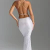 Robe longue dos nu à découpes et ornements Magdalena, blanche Robe longue dos nu à découpes et ornements Magdalena, blanche