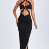 Robe longue à dos nu et découpes Bethania, détails métalliques, en noir Robe longue à dos nu et découpes Bethania, détails métalliques, en noir