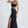 Robe longue Julitta à découpes et détails métalliques, en noir Robe longue Julitta à découpes et détails métalliques, en noir
