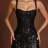 Robe mi-longue corsetée Raffaella avec découpes, en zèbre noir Robe mi-longue corsetée Raffaella avec découpes, en zèbre noir