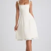 Robe midi plissée évasée Isadora avec nœud, couleur ivoire Robe midi plissée évasée Isadora avec nœud, couleur ivoire