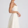 Robe midi plissée évasée Isadora avec nœud, couleur ivoire Robe midi plissée évasée Isadora avec nœud, couleur ivoire