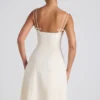Robe midi plissée évasée Isadora avec nœud, couleur ivoire Robe midi plissée évasée Isadora avec nœud, couleur ivoire