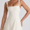 Robe midi plissée évasée Isadora avec nœud, couleur ivoire Robe midi plissée évasée Isadora avec nœud, couleur ivoire