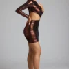 Robe Nasira en jersey métallisé à découpes, couleur cuivre bronze Robe Nasira en jersey métallisé à découpes, couleur cuivre bronze