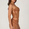 Robe Rania à découpes et ornements, couleur bronze Robe Rania à découpes et ornements, couleur bronze
