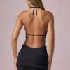 Robe Tarryn à volants, dos nu et col licou, en noir Robe Tarryn à volants, dos nu et col licou, en noir
