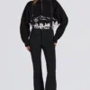 Salopette imperméable à taille haute avec bretelles, en noir