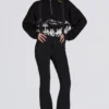 Salopette imperméable à taille haute avec bretelles, en noir