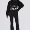 Salopette imperméable à taille haute avec bretelles, en noir