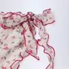 Sarong Molinas à nouer sur le côté, imprimé floral rouge Sarong Molinas à nouer sur le côté, imprimé floral rouge