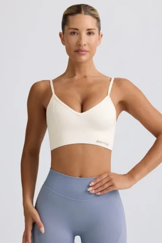 Soutien-gorge de sport Define Luxe à col en V, blanc