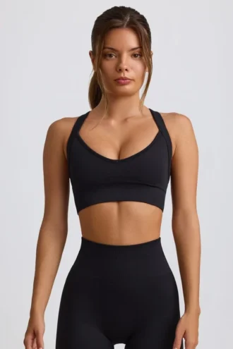 Soutien-gorge de sport sans coutures Super Sculpt à dos croisé, noir