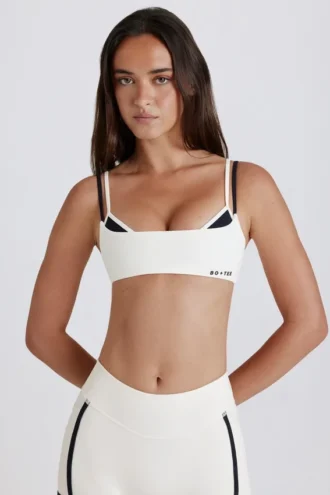 Soutien-gorge de sport Soft Active à dos torsadé et superpositions, couleur ivoire