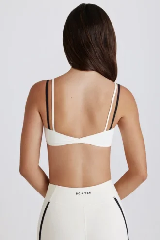 Soutien-gorge de sport Soft Active à dos torsadé et superpositions, couleur ivoire
