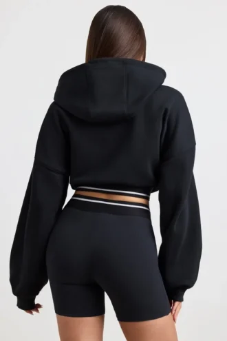 Sweat à capuche court en molleton de coton extensible, noir