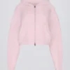 Sweat à capuche court zippé en maille douce, rose pâle