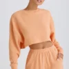 Sweat-shirt court à dos ouvert en jersey de coton texturé, couleur pêche
