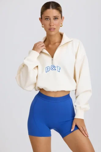 Sweat-shirt court à fermeture éclair quart de longueur, blanc