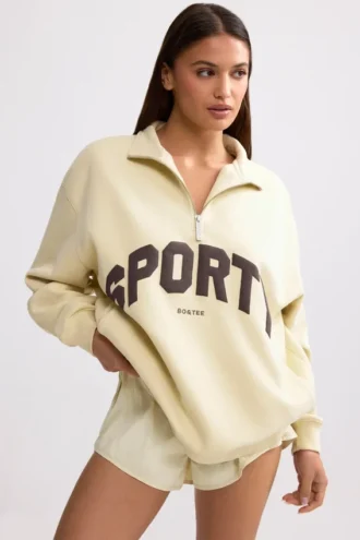 Sweat-shirt à fermeture éclair quart de longueur, couleur ivoire