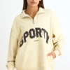 Sweat-shirt à fermeture éclair quart de longueur, couleur ivoire Sweat-shirt à fermeture éclair quart de longueur, couleur ivoire