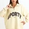 Sweat-shirt à fermeture éclair quart de longueur, couleur ivoire Sweat-shirt à fermeture éclair quart de longueur, couleur ivoire